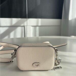 Cream Crossbody Bag with Structured Design and Silver Hardware